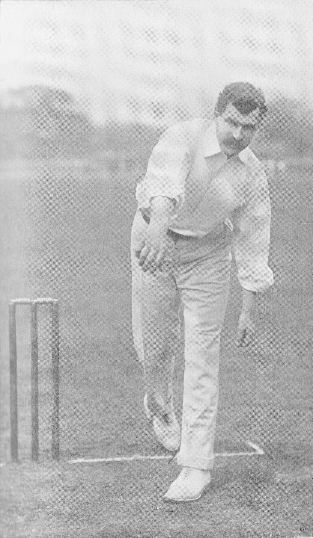 Ein Mann in einem weißen Hemd und Hose, der Cricket spielt, mit Wickets auf dem Boden, Bäumen und Himmel im Hintergrund und dem Text "Cricket-Spieler des Jahres" unten.