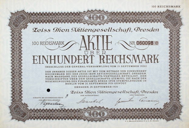 Alter deutscher Wertpapierprospekt für 100 Reichmarks mit schwarzem Rand und deutschem Text.